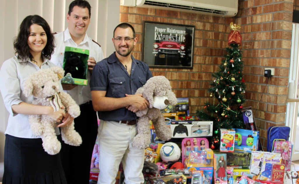 Bethany Wagstaff, Lieutenant Richard Day and Dr Duanne Spiccia with the mountain of toys donated by patients in the Toys for Treatment day at Alive Chiropractic. Bethany Wagstaff, Lieutenant Richard Day and Dr Duanne Spiccia with the mountain of toys donated by patients in the Toys for Treatment day at Alive Chiropractic.